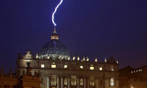 A lightning strikes the basilica of St Peter's dome